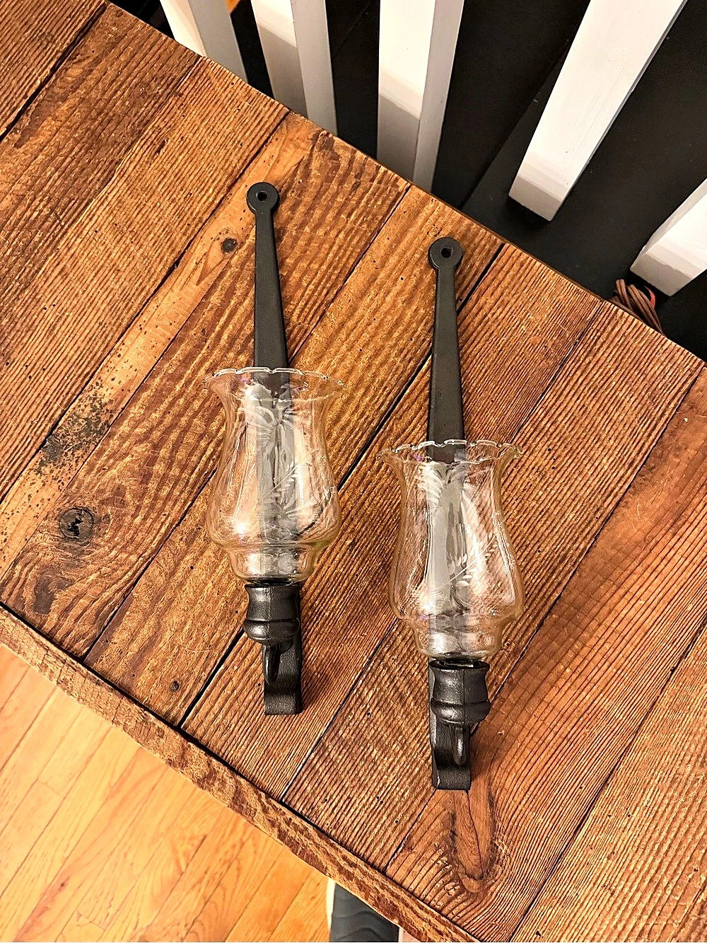 Pair of vintage Wilton Products cast iron wall sconces with etched glass votive